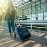 A traveler with a suitcase.